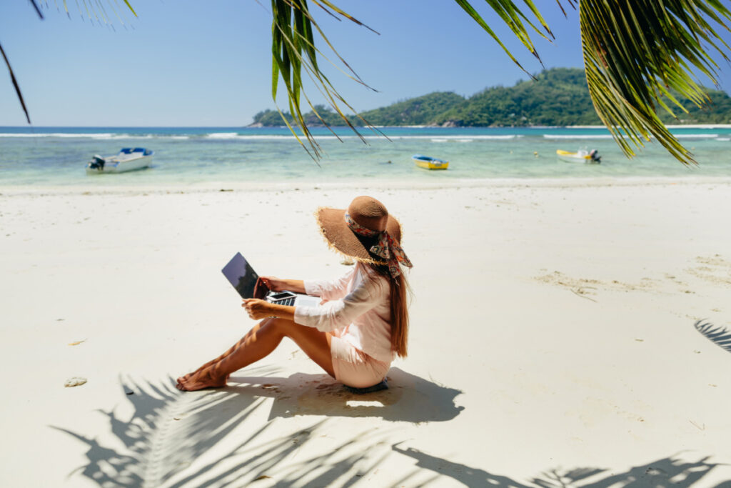 Woman Working on the Beach